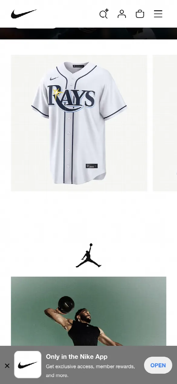 Nike’s home page on a phone: a row of product photos, a Tampa Bay Rays jersey and the edge of the next product, with no names or prices.