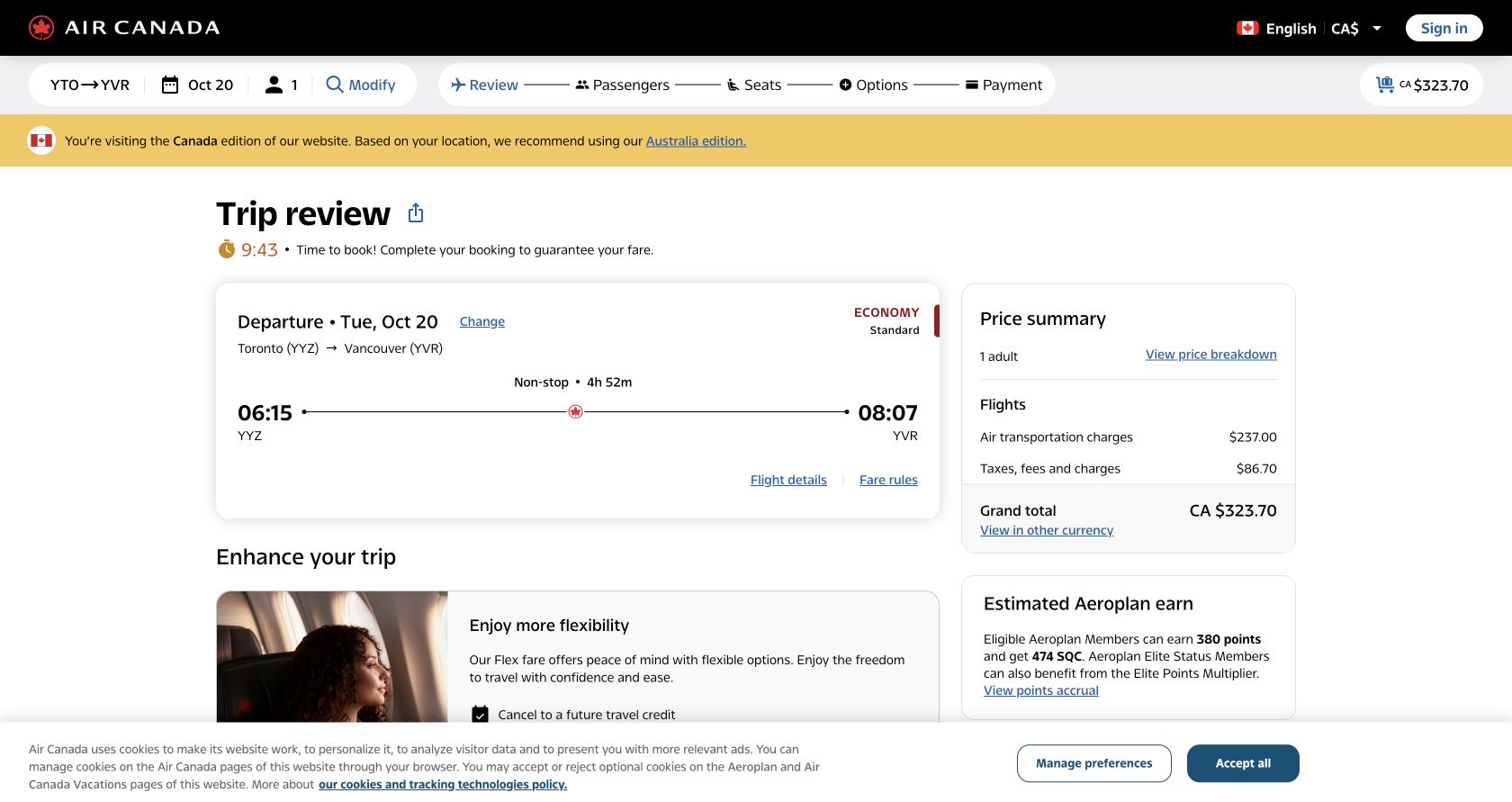 Air Canada review page itemising transportation, taxes and fees and the final C$323.70 total