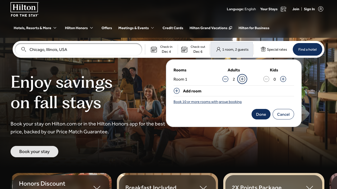 Hilton's home page search filled in with Chicago, Illinois, USA, Dec 4 to Dec 6 and 1 room, 2 guests, with the guest panel open showing 2 adults and 0 kids